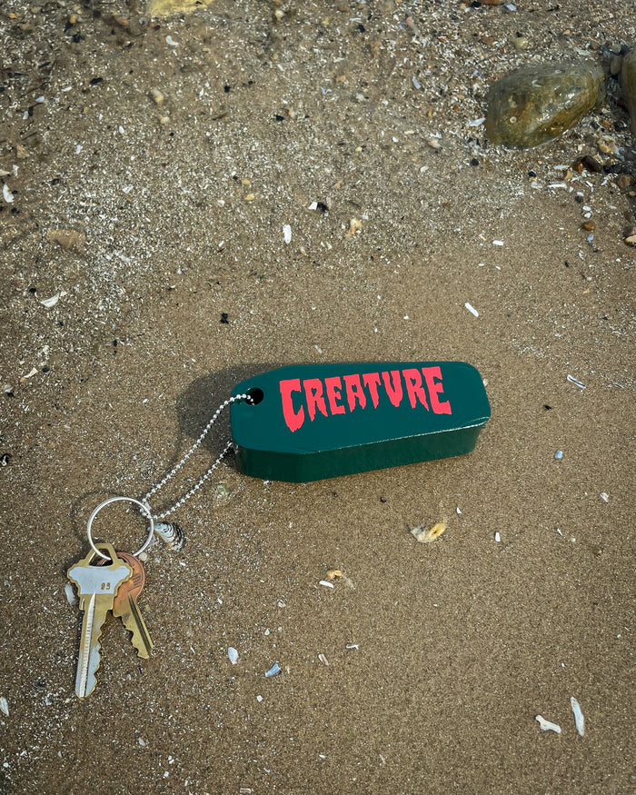Creature Lost At Sea Dark Green Floatie Key Chain
