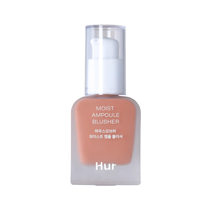 A bottle of Hur Moist Ampoule Blusher in a warm peachy nude shade, featuring a frosted glass container, white pump dispenser, and clear cap, set against a plain white background.